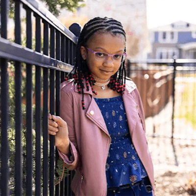 Angelina smiling while playing outside.