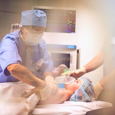 Providers caring for child in emergency room.