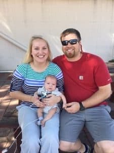 Austin Simon sitting with his parents.