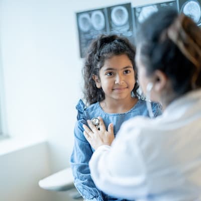 Provider examining young child.