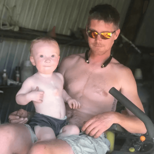 Jake holding his son, Kash.