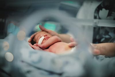 Infant patient in the neonatal intensive care unit.