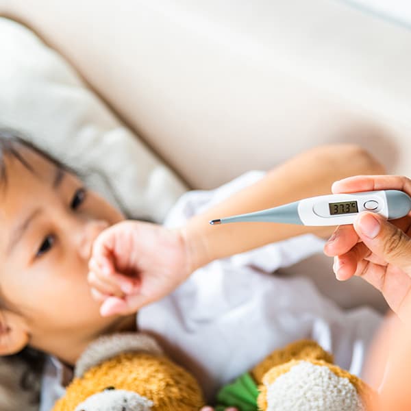 Child with thermometer.