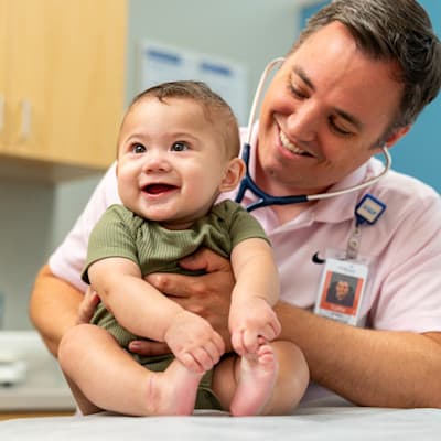 Children's Physician's primary care provider performing an exam on an infant.