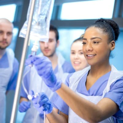 Students learning in a hospital setting.