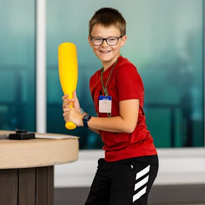 Children's Nebraska patient playing baseball in the atrium.