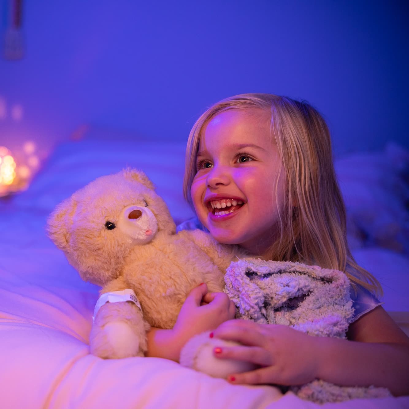 Young patient at home with teddy bear.