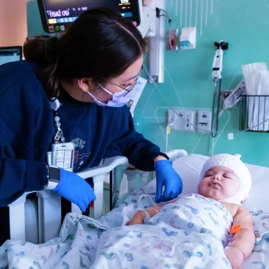 Baby sleeping in a hospital bed