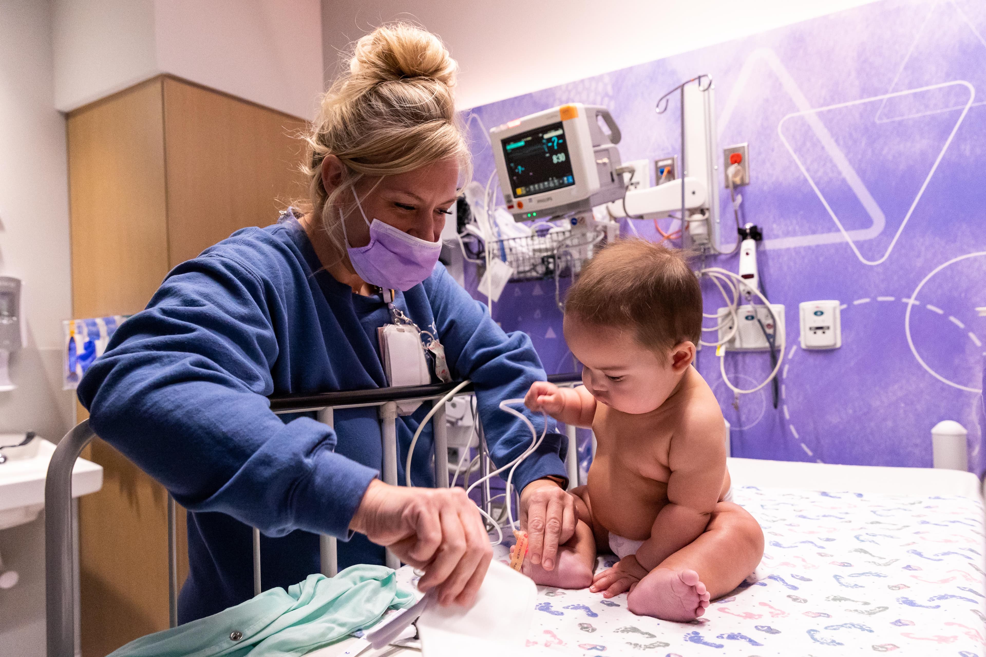 Baby in hospital crib