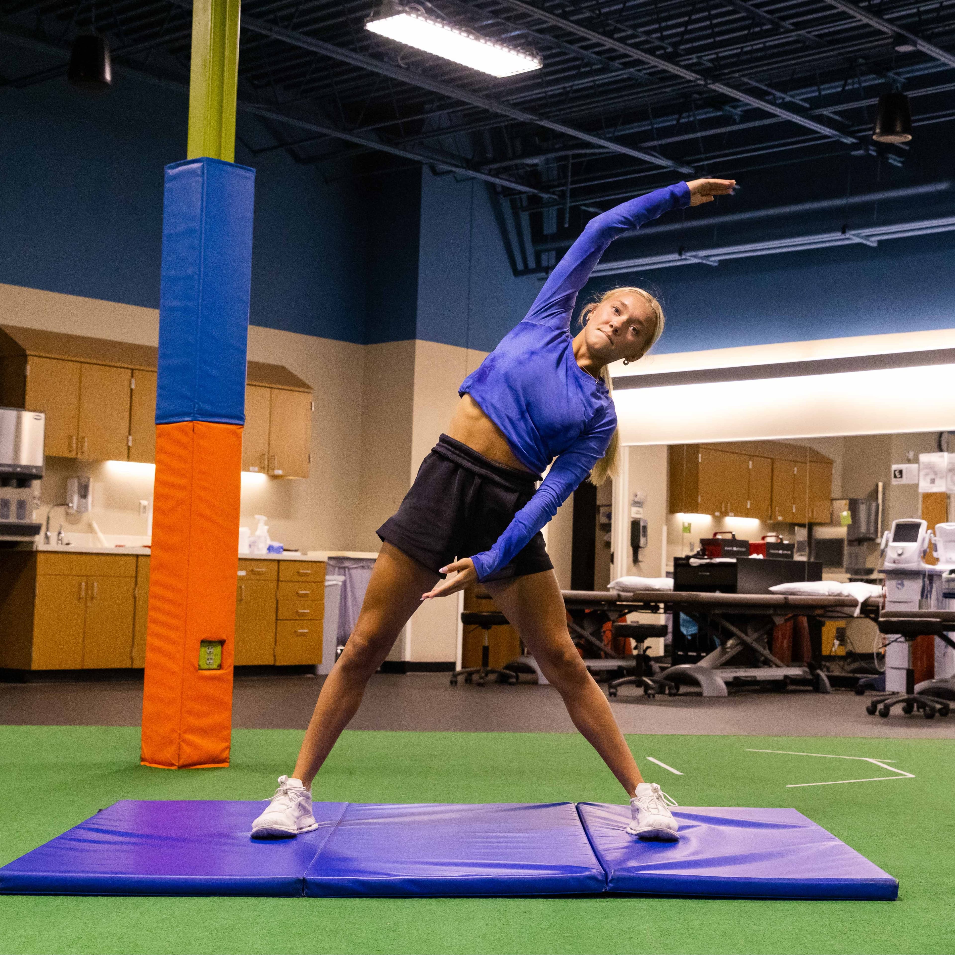 Ava going through performing arts sports physical therapy.