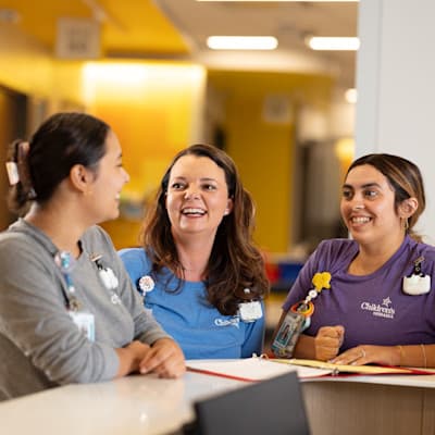 Nurses talking on patient floor.