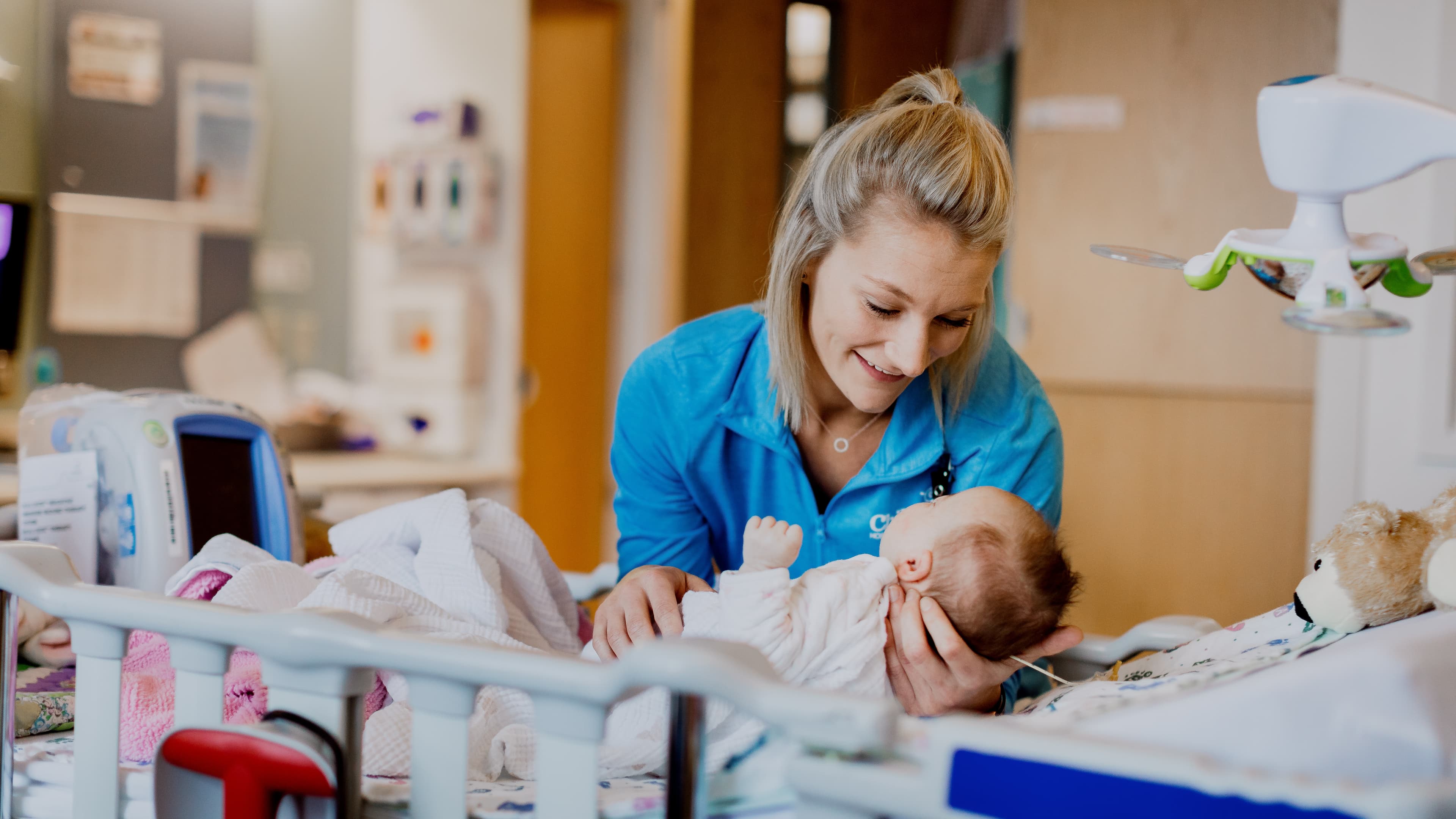 Children's Nebraska nurse caring for an infant in the hospital.